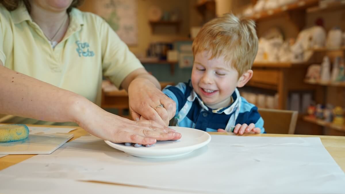 toddler-handprint-on-pottery-plate